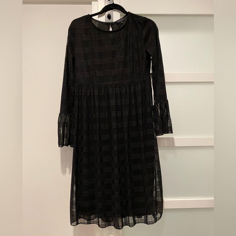 Roolee midi dress. Color black. Subtle plaid print with ruffle sleeves. Size M.